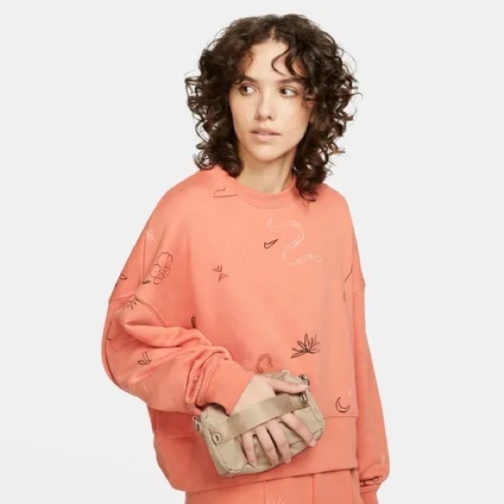 Nike cropped crew neck jumper in orange with playful desert-themed prints